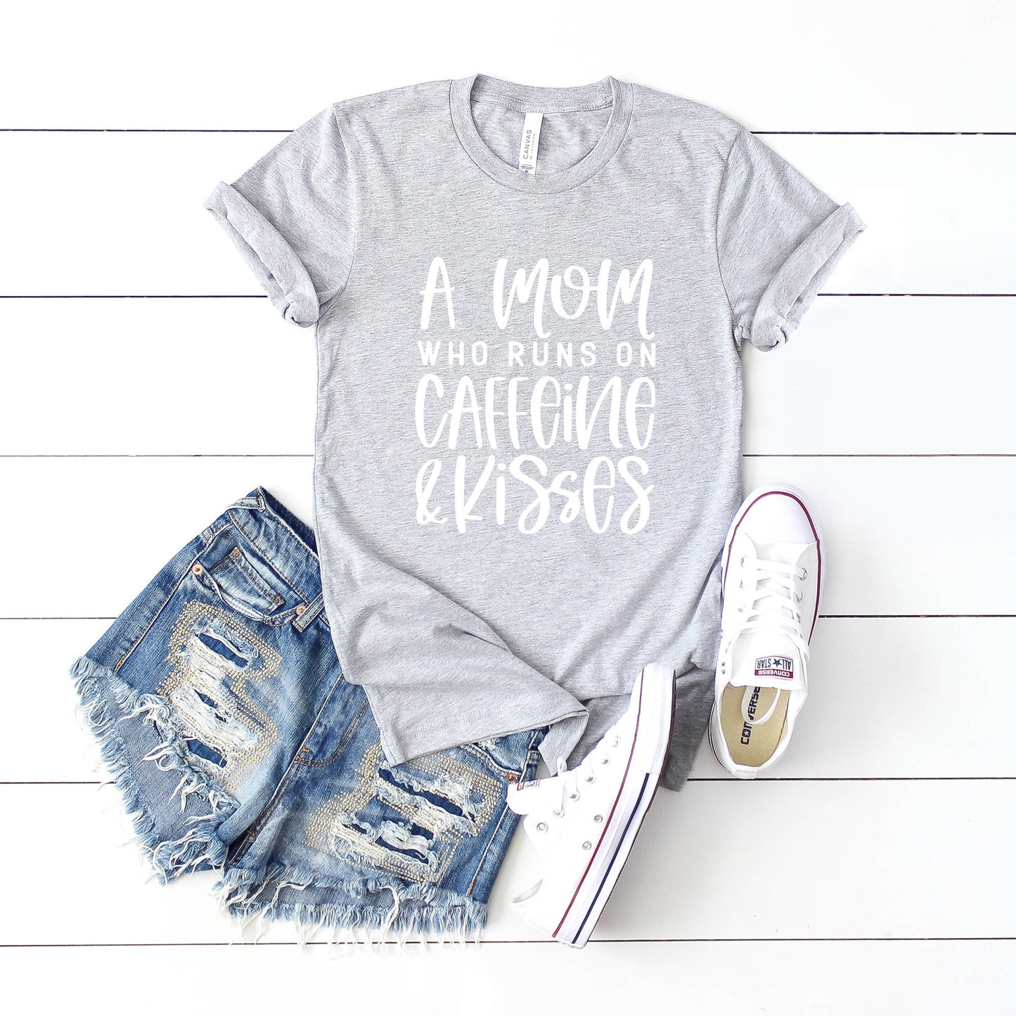 A Mom Who Runs On Caffeine And Kisses | Short Sleeve Crew Neck