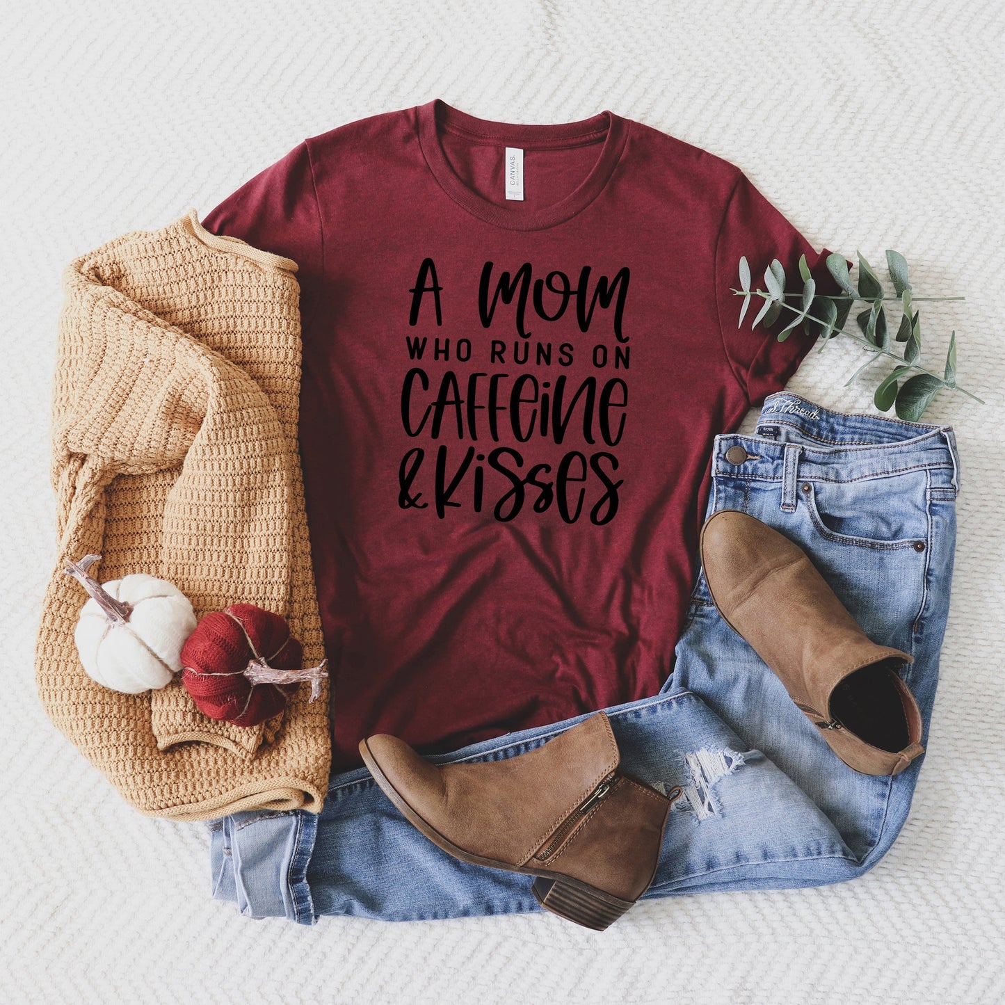 A Mom Who Runs On Caffeine And Kisses | Short Sleeve Crew Neck