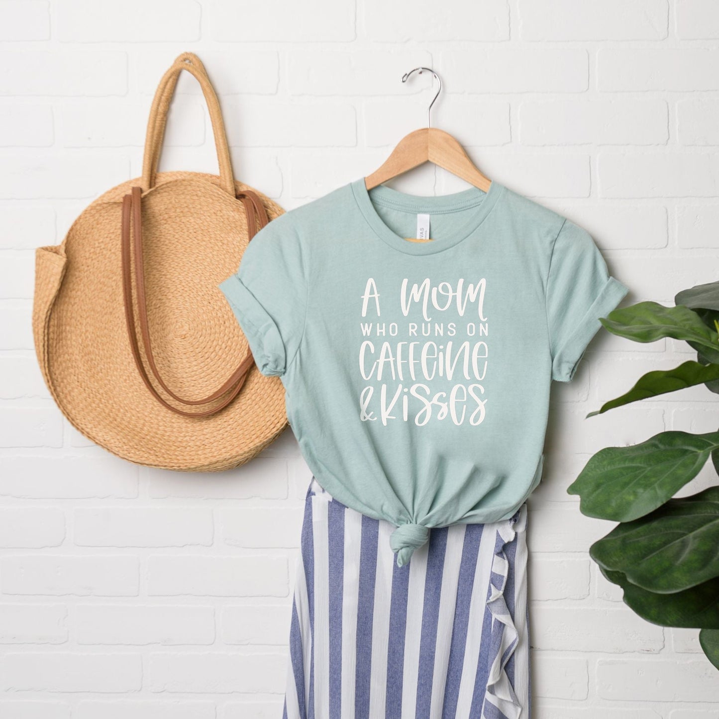 A Mom Who Runs On Caffeine And Kisses | Short Sleeve Crew Neck