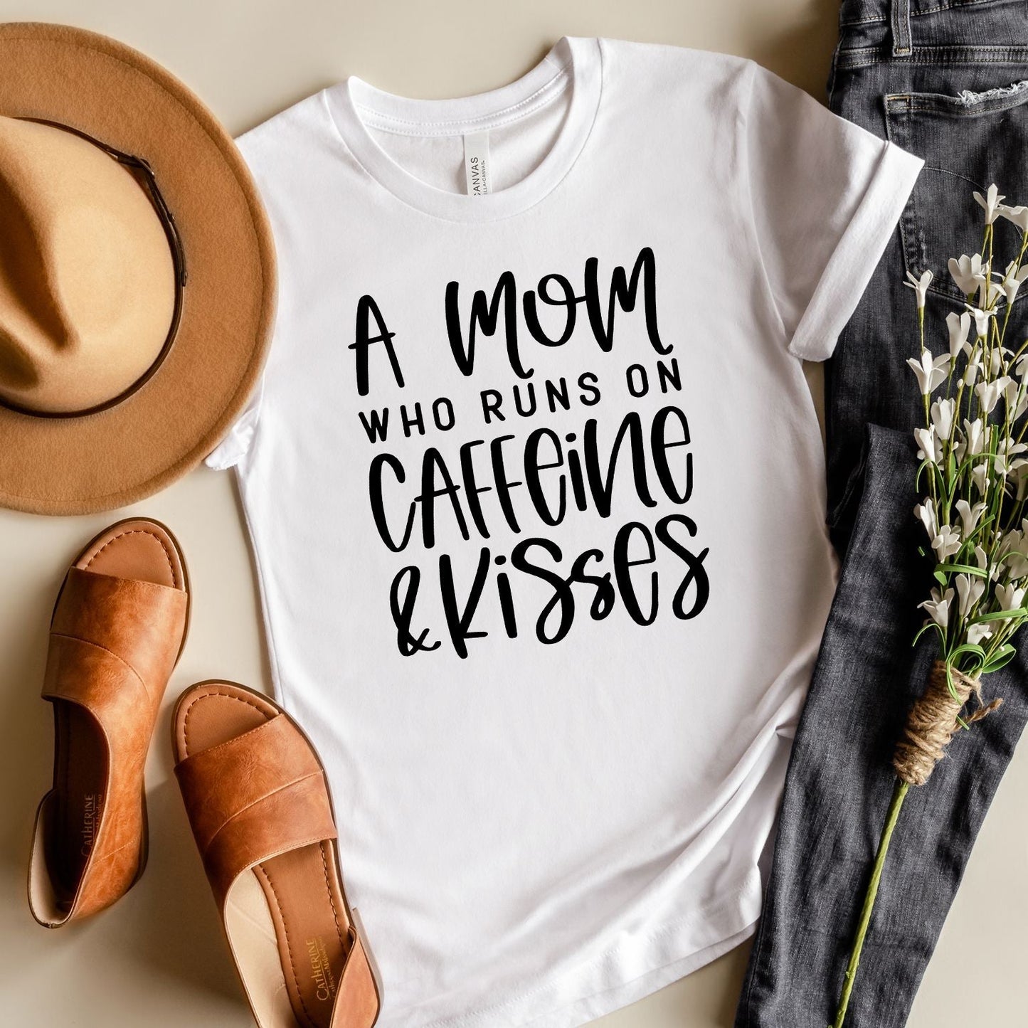 A Mom Who Runs On Caffeine And Kisses | Short Sleeve Crew Neck