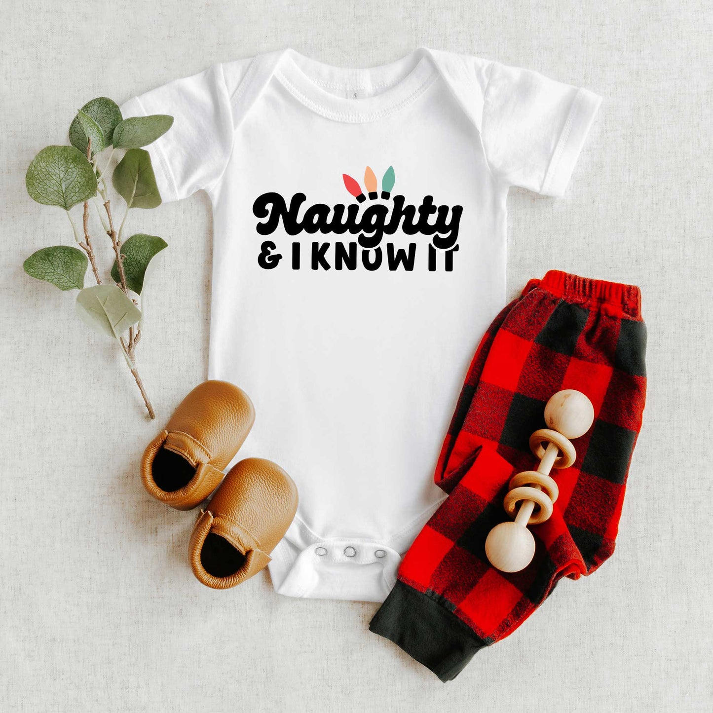 Naughty And I Know It Lights | Baby Graphic Short Sleeve Onesie