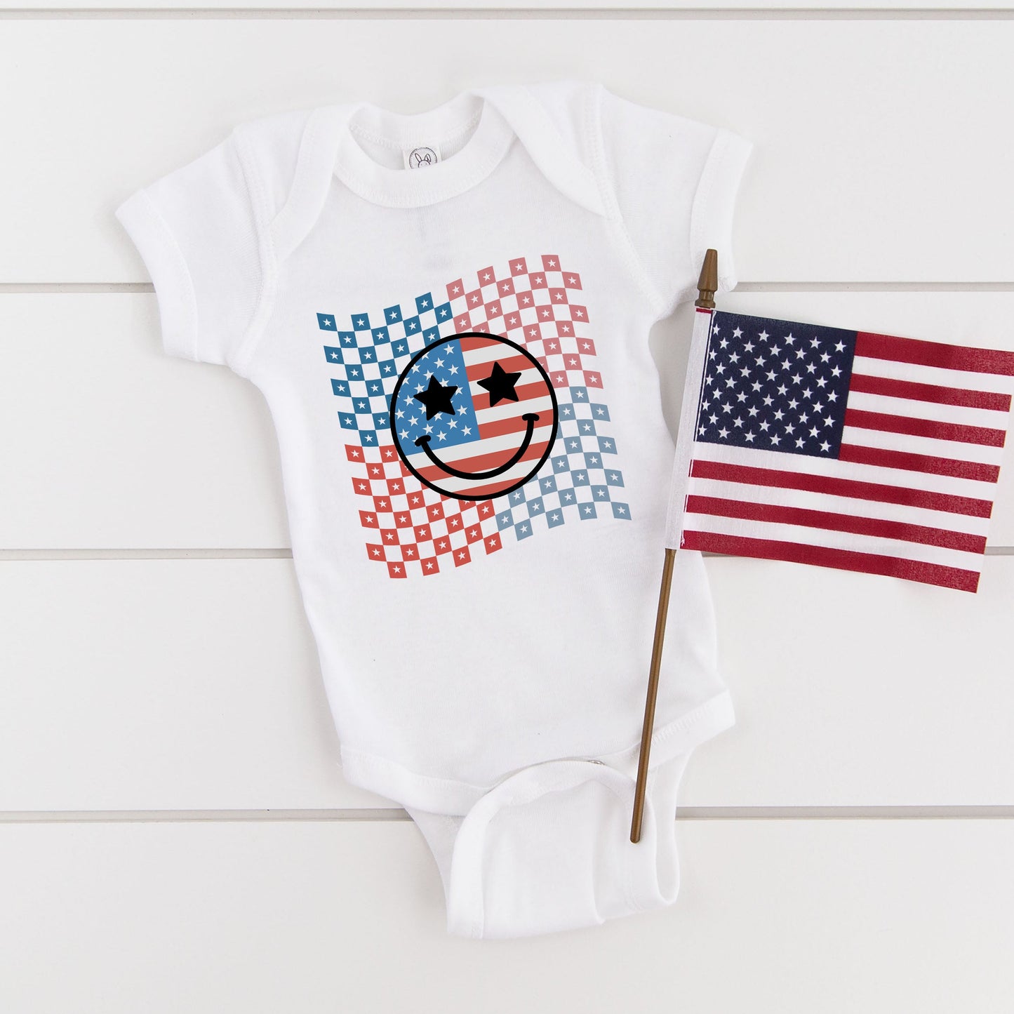 Checkered Patriotic Smiley Face | Baby Graphic Short Sleeve Onesie