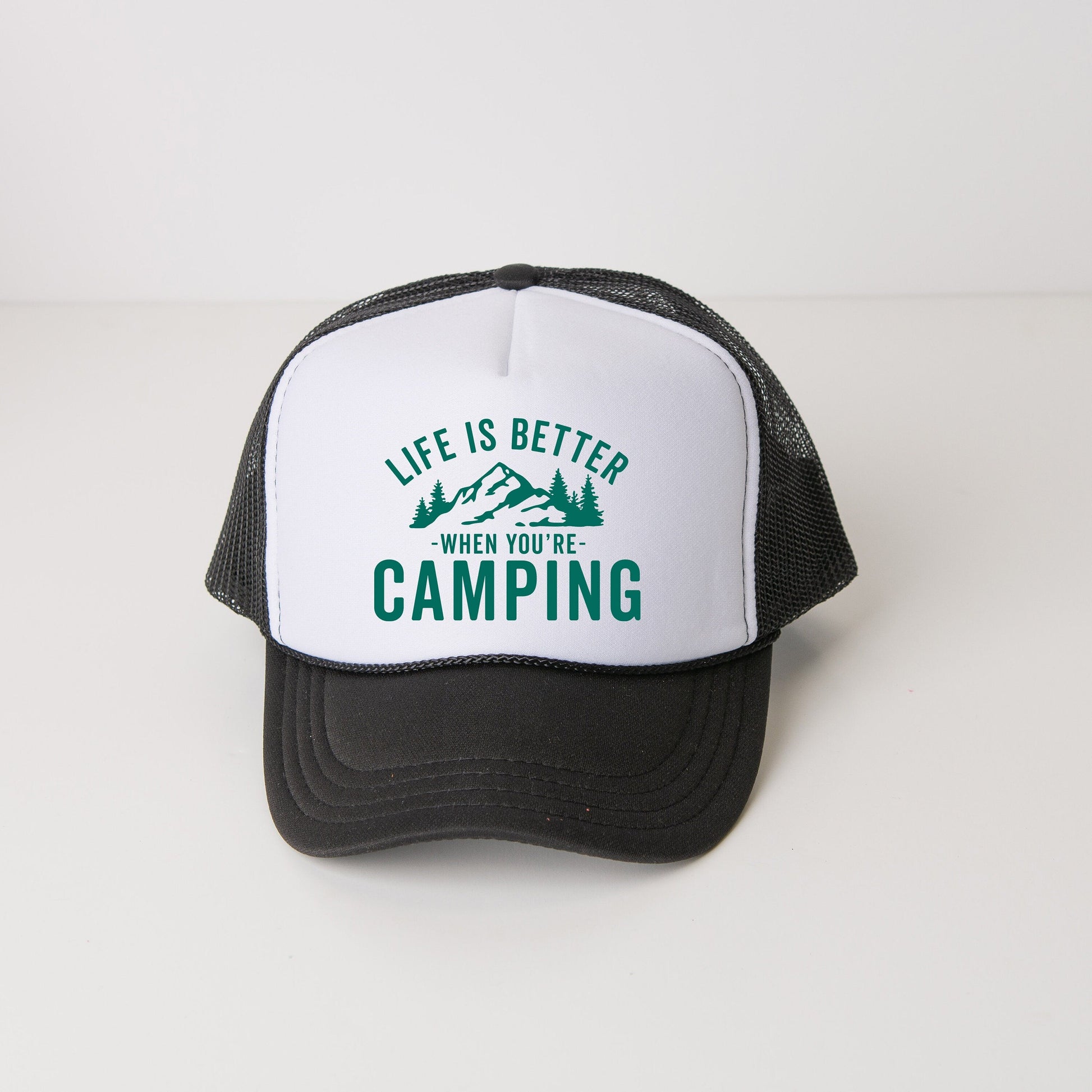 a black and white trucker hat that says life is better when you&#39;re