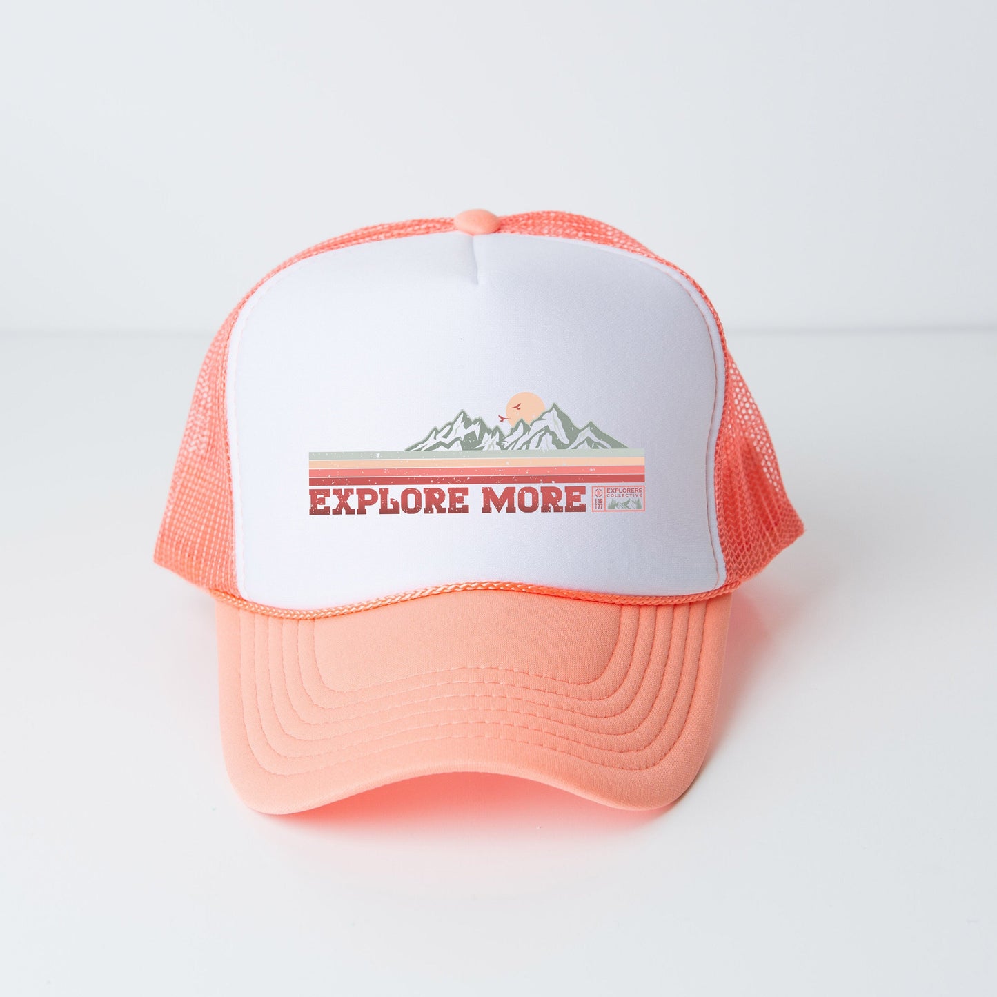 a trucker hat with the words explore more on it