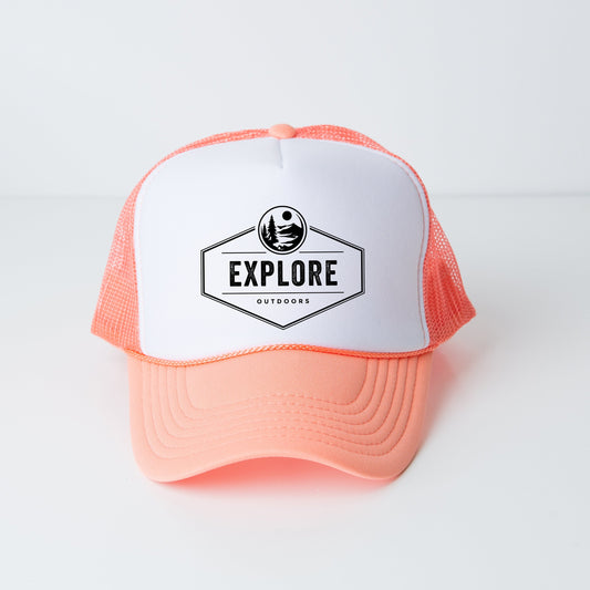 a white and orange trucker hat with the explore logo on it