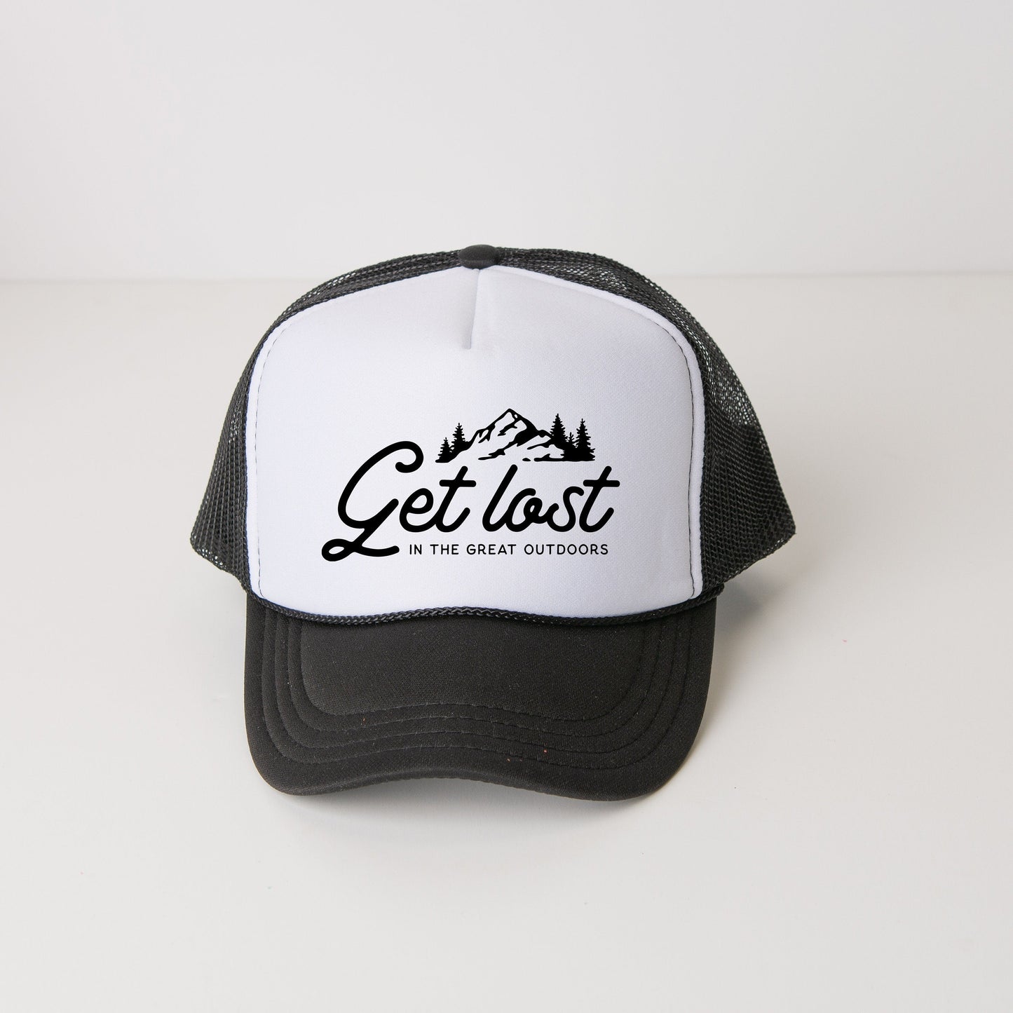 a black and white hat with the words get lost on it
