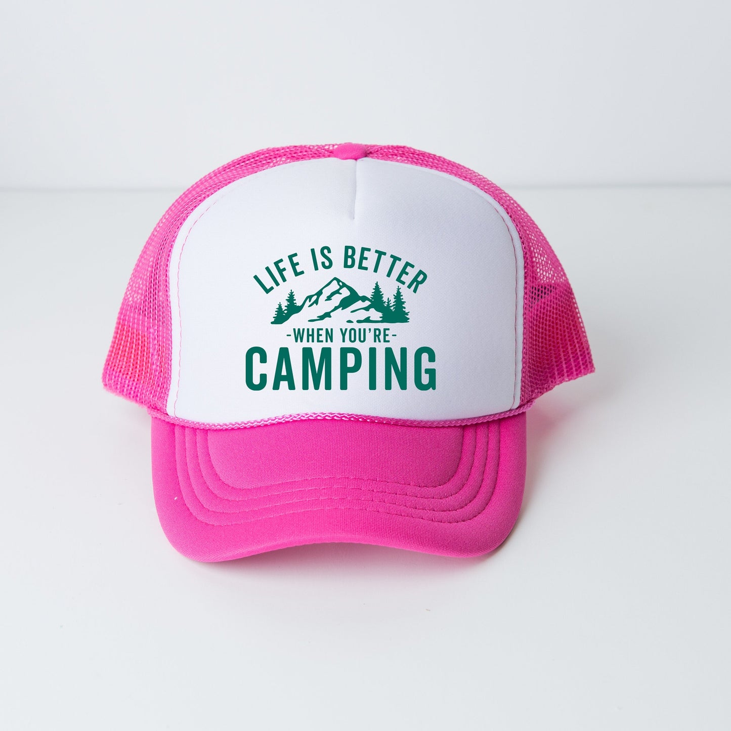 a pink and white trucker hat that says life is better when you&#39;re