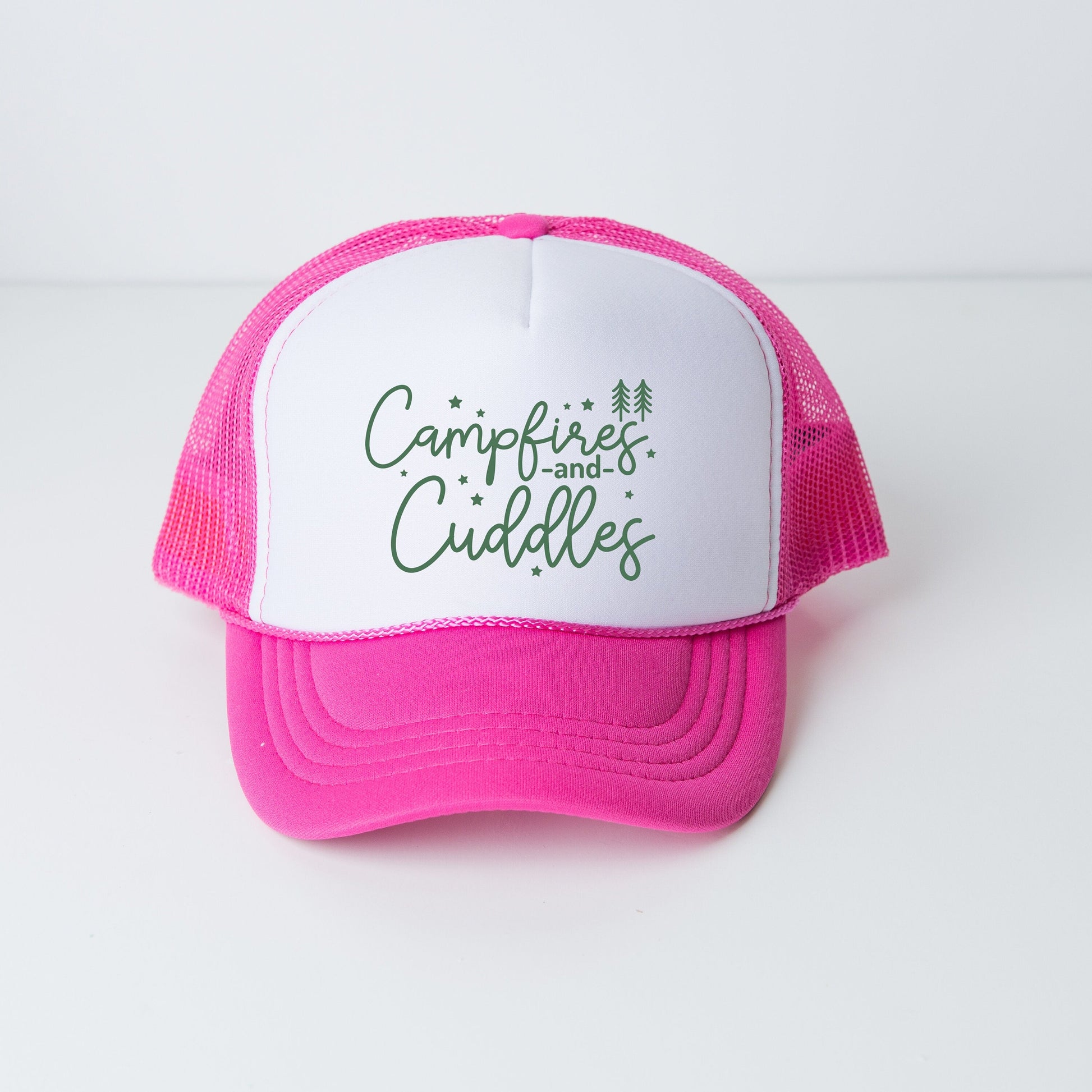 a pink and white trucker hat with the words campfire and cuddles