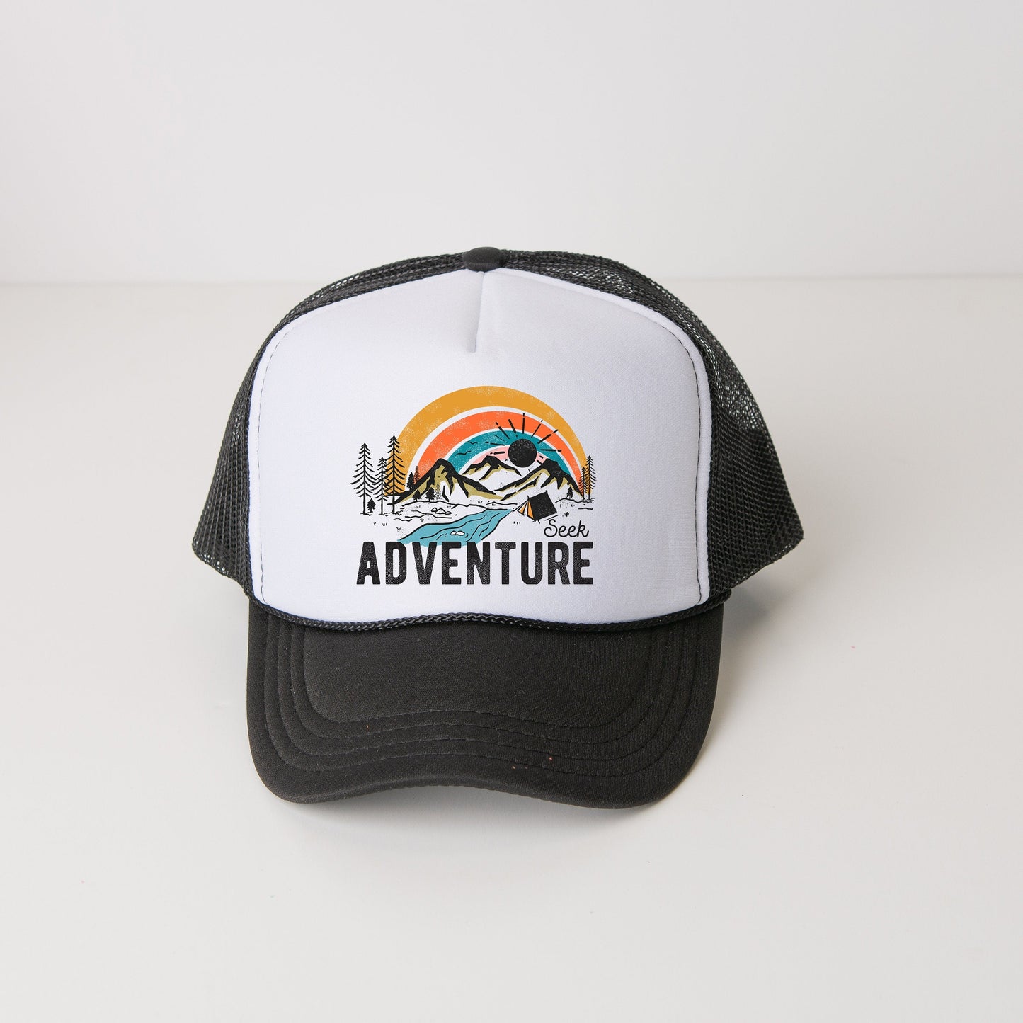 a black and white hat with the words adventure on it