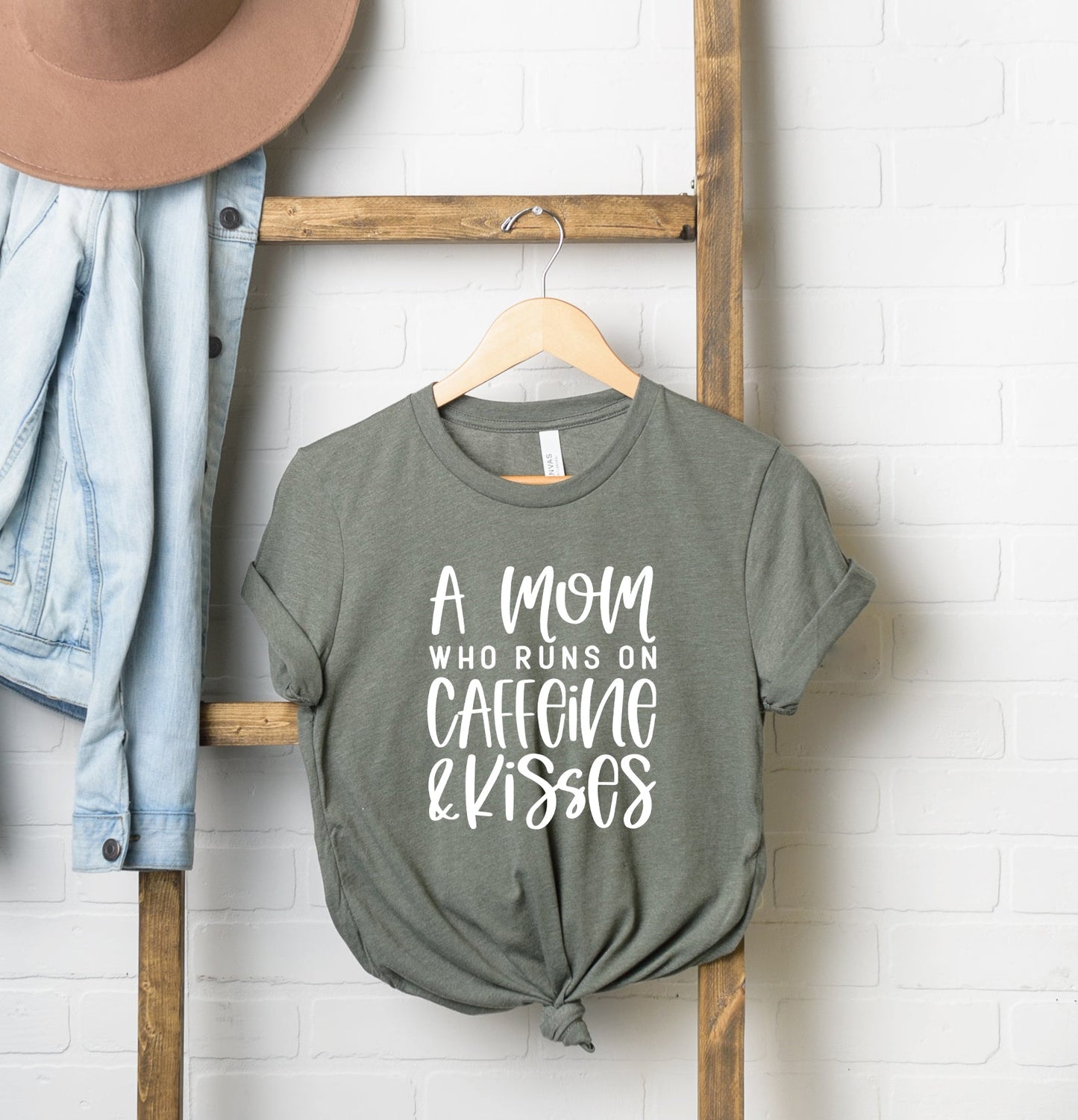 A Mom Who Runs On Caffeine And Kisses | Short Sleeve Crew Neck