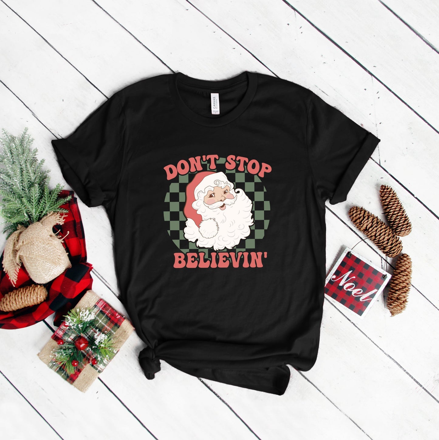 Don't Stop Believin' Santa Checkered | Short Sleeve Graphic Tee | Christmas