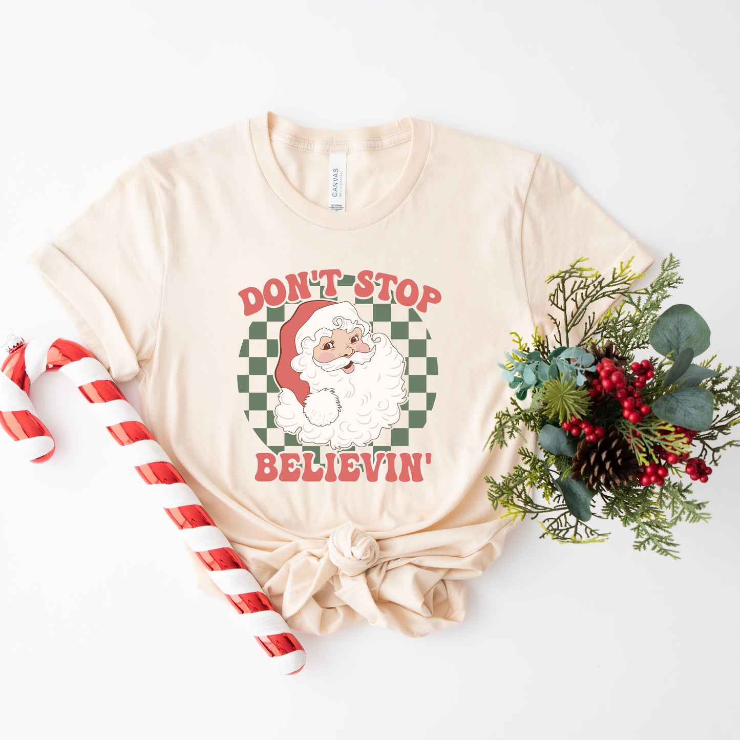 Don't Stop Believin' Santa Checkered | Short Sleeve Graphic Tee | Christmas