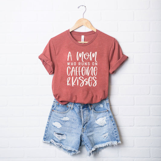 A Mom Who Runs On Caffeine And Kisses | Short Sleeve Crew Neck