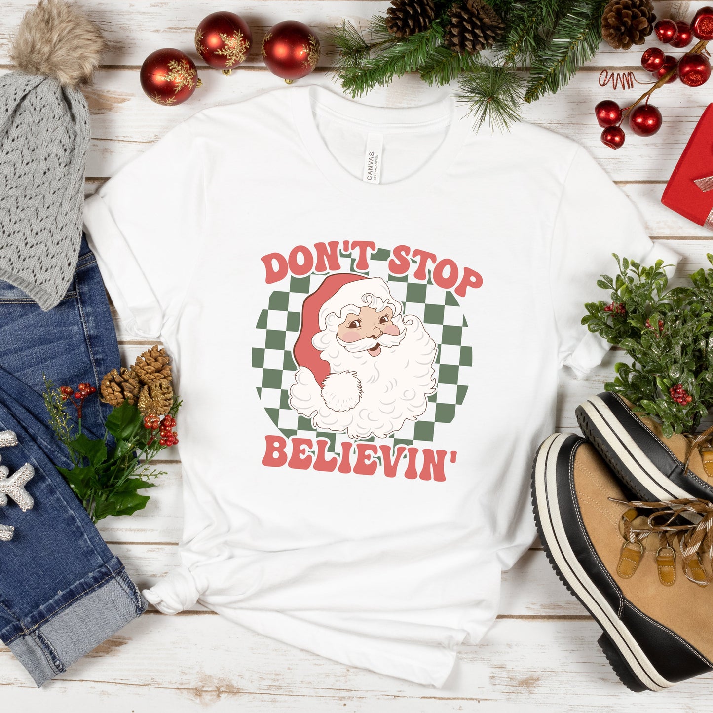 Don't Stop Believin' Santa Checkered | Short Sleeve Graphic Tee | Christmas